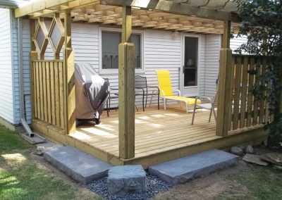 Wooden deck and pergola designed in a residential backyard