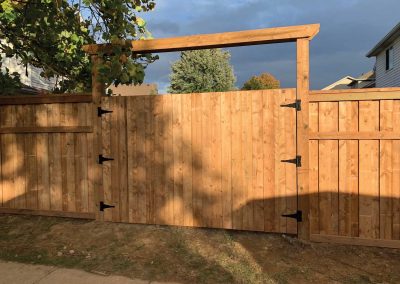 Large residential wooden fence and gate