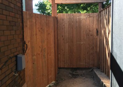 Wooden residential fence with wooden gate